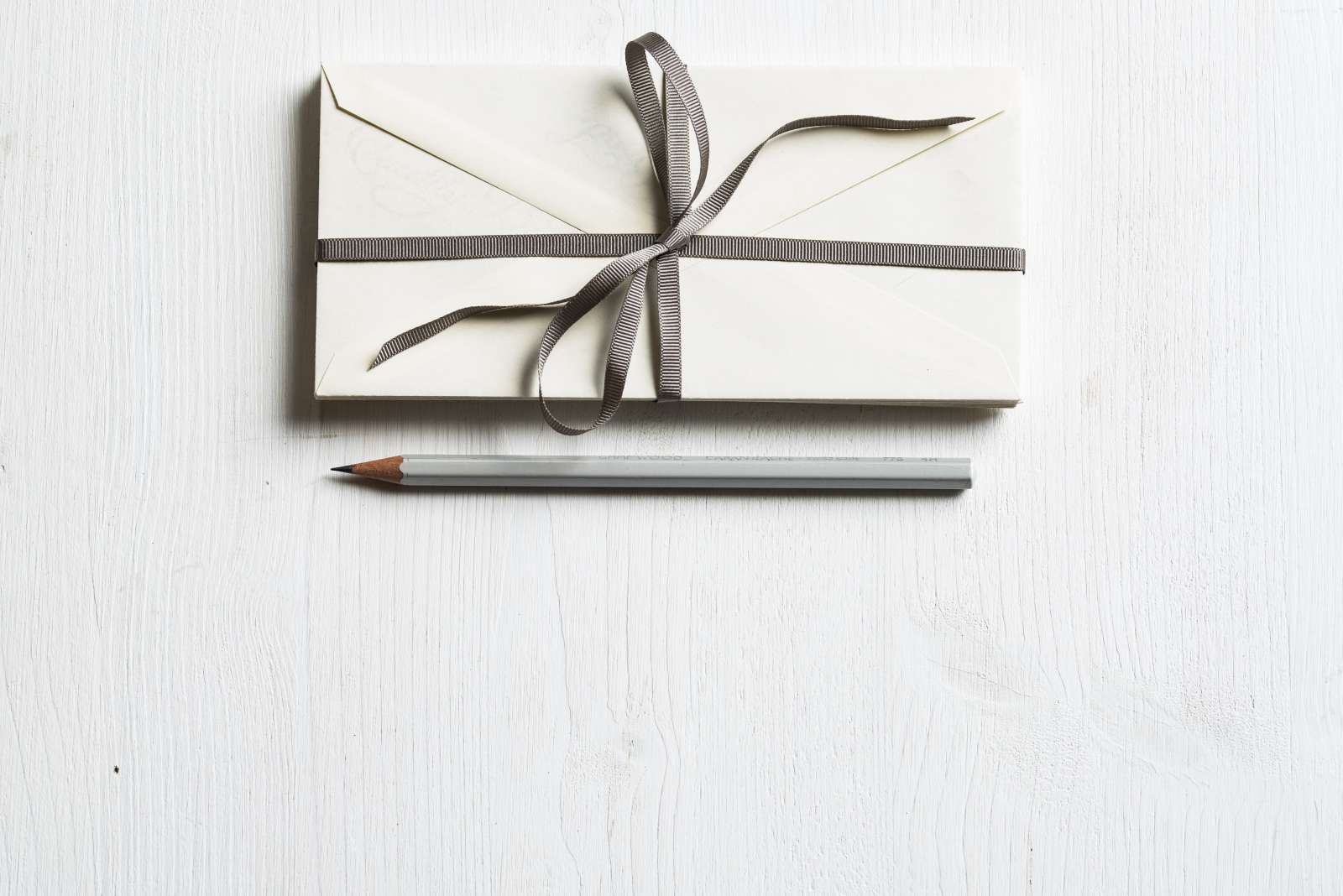 A pencil and letter