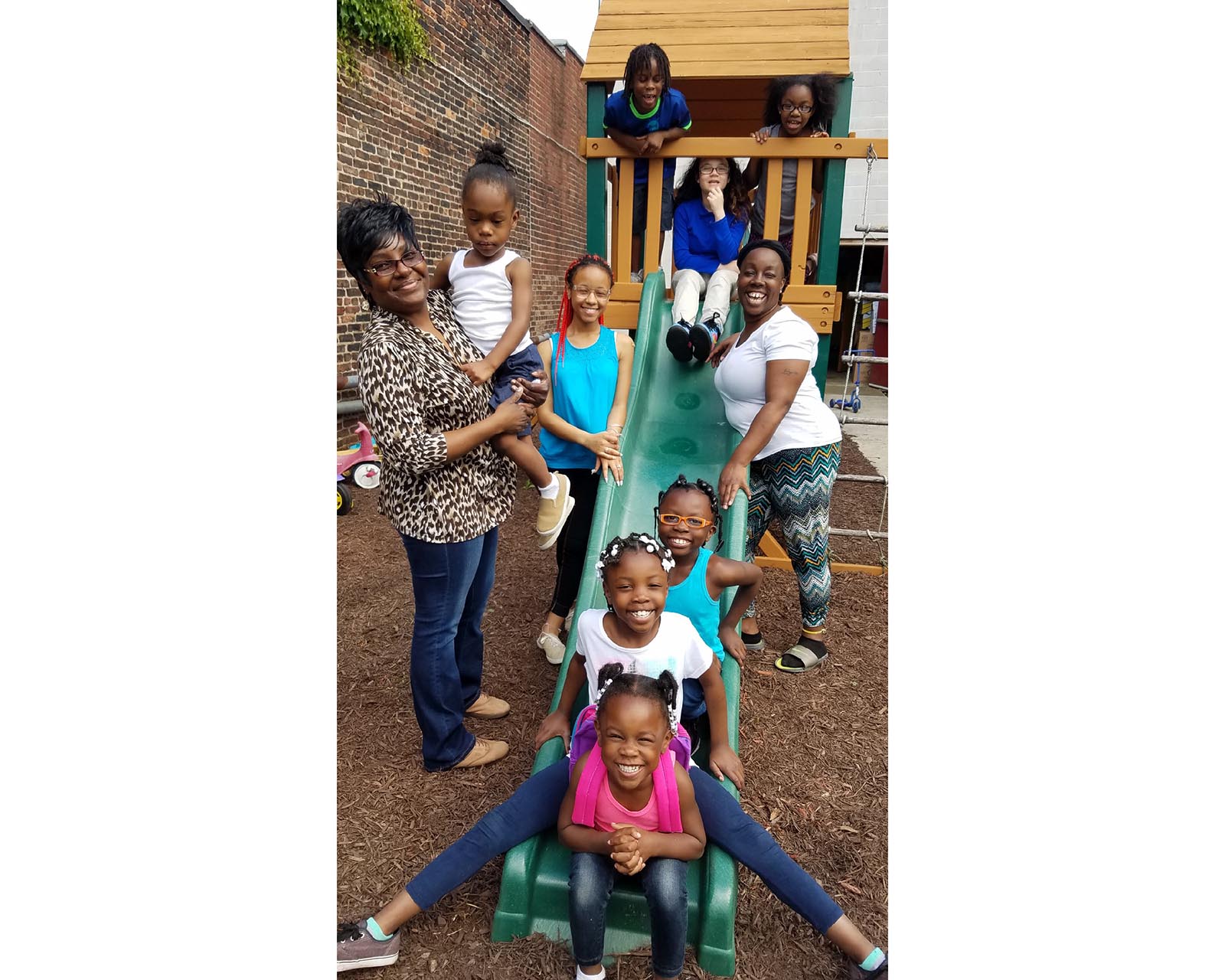 A group of women and children on a playground